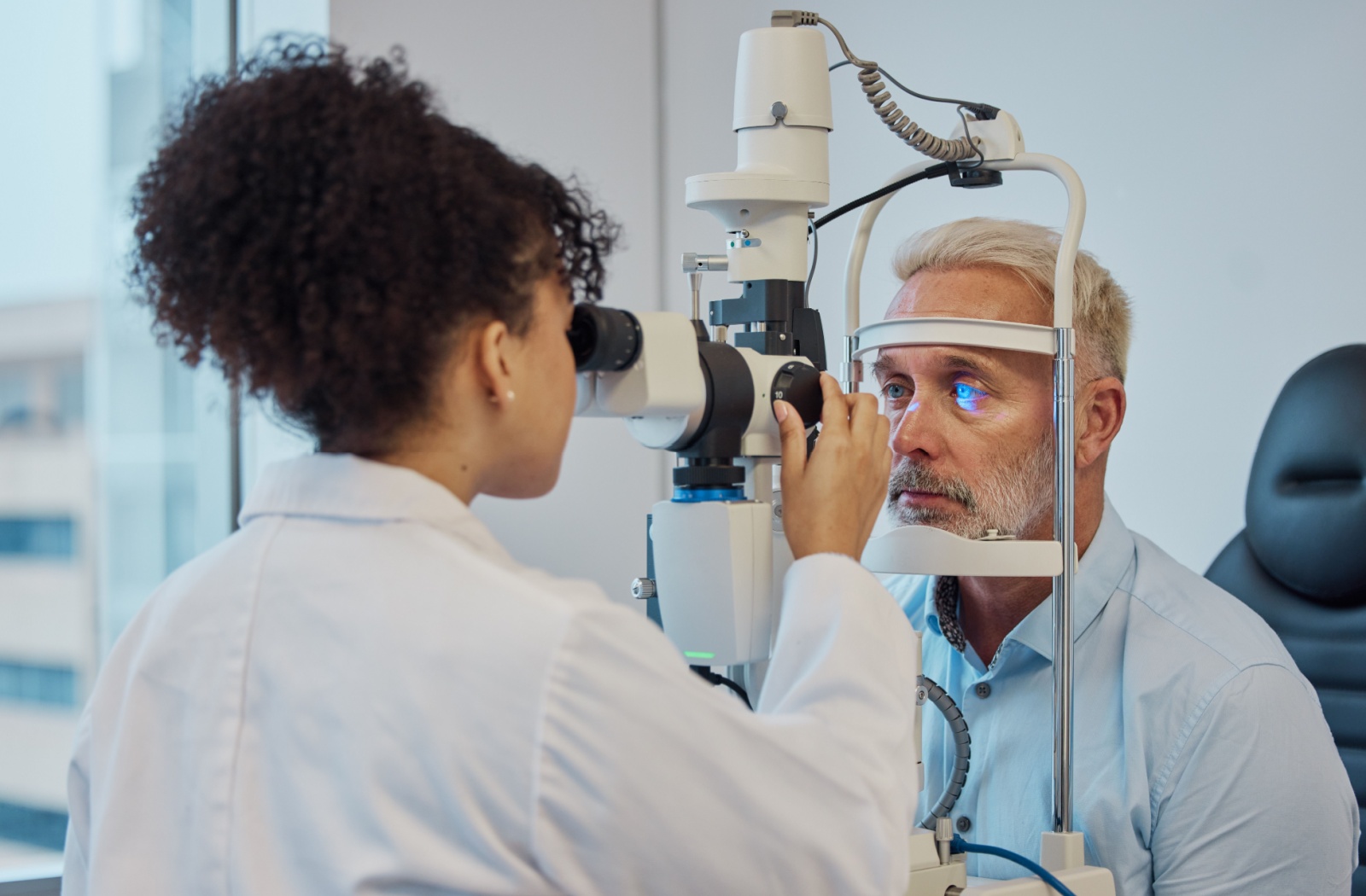 A person undergoing an eye exam to check for signs of macular degeneration